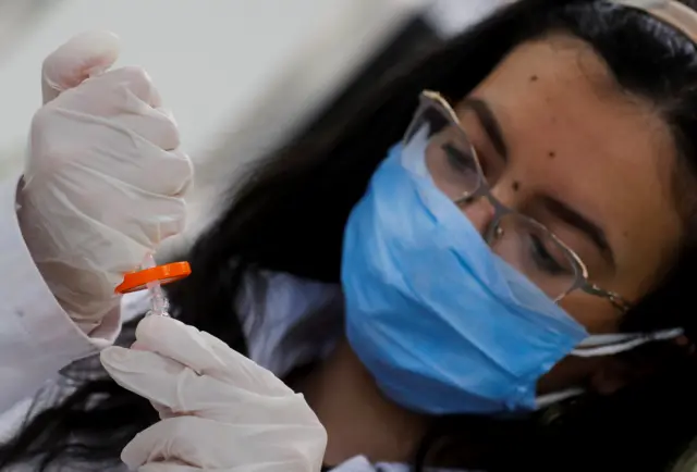 A scientist works on the drug Remdesivir