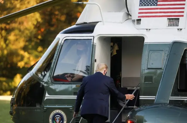 President Donald Trump boards Marine One helicopter to be flown to hospital. Photo: 2 October 2020