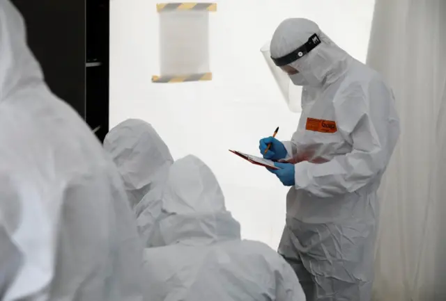 Healthcare officials work at a Covid test centre in Warsaw, Poland. Photo: 2 October 2020