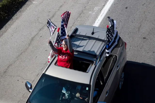 Supporters of US President Donald Trump take part in a car parade in Columbus, Ohio, on 3 October 2020