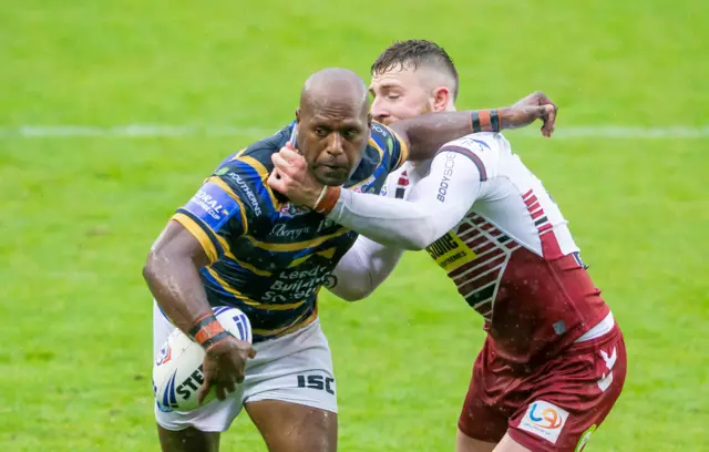 Leeds's Rob Lui fends off Wigan's Jackson Hastings