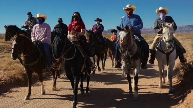 A group of riders on horseback in the Navajo Nation