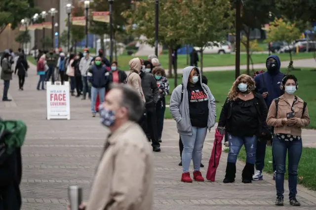 Voters queue in at Morgan State University in Baltimore, Maryland where early voting began on Monday