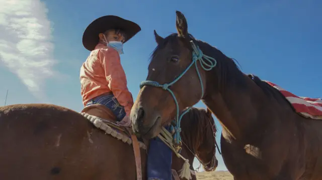 A boy pictured on horseback in the Navajo Nation