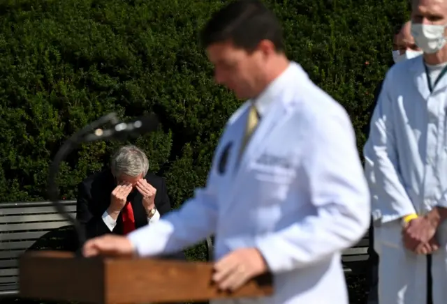 Mark Meadows with his head in his hands