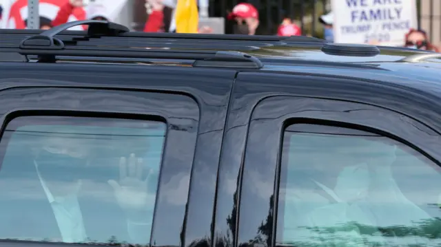 Trump waves to supporters from his armoured car