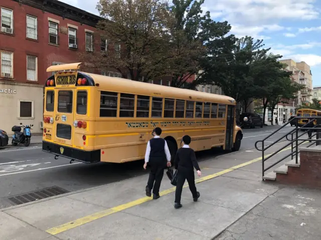 A school bus near Orthodox Jewish students