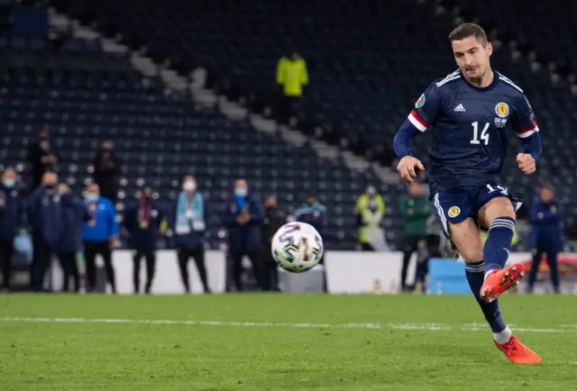 Kenny McLean scores the winning penalty