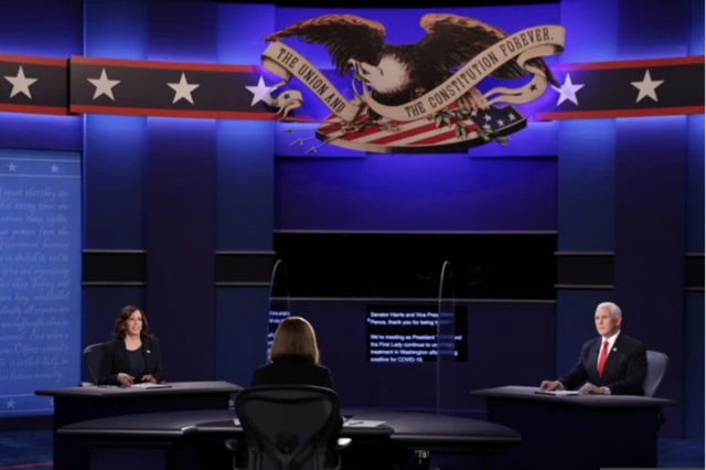 Mike Pence and Kamala Harris share a stage at the vice-presidential debate on Wednesday