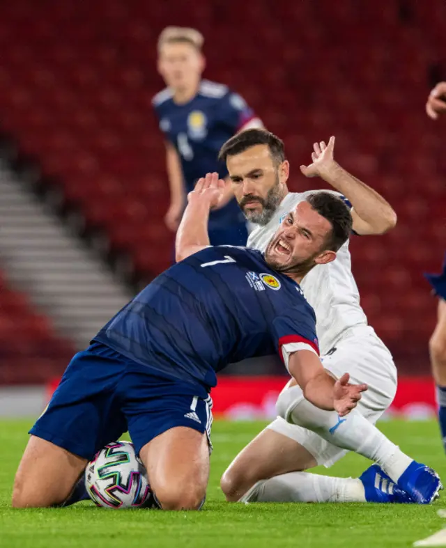 Scotland's John McGinn is fouled by Bibras Natcho