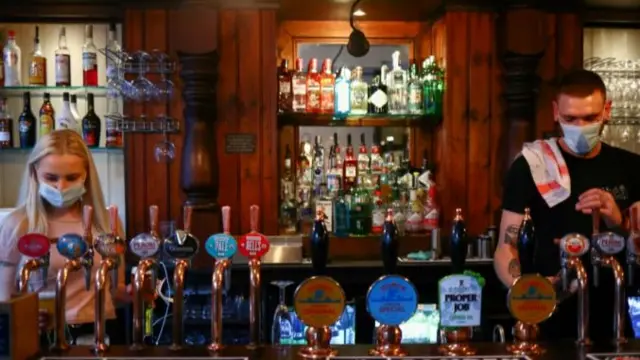 Staff at pub in masks