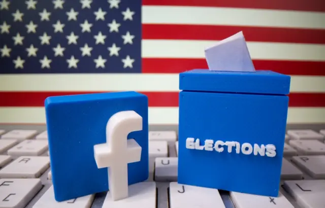 A 3D-printed elections box and Facebook logo are placed on a keyboard in front of U.S. flag in this illustration taken October 6, 2020.