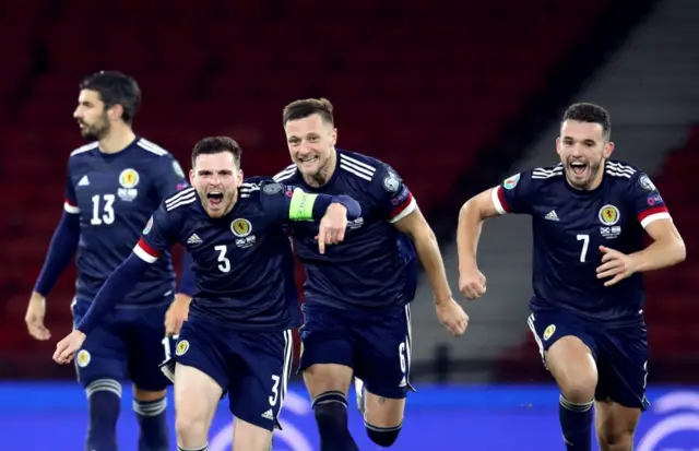 Scotland players celebrate after they beat Israel on penalties