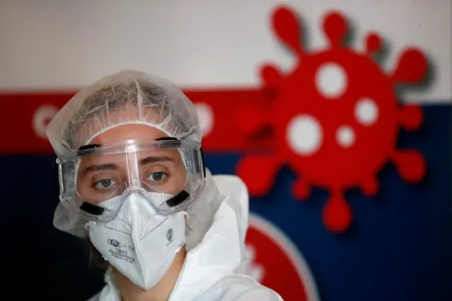 A health official in protective suit works at Covid testing site in Nantes, France. Photo: October 2020