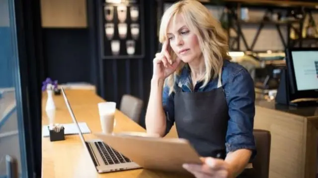 A business owner working out her finances