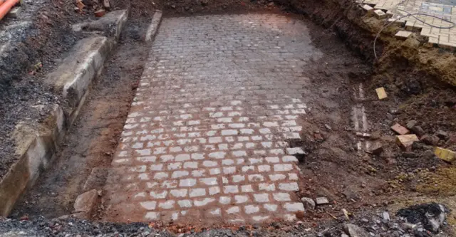 Some of the original cobbled paving that used to be part of Smithford Street