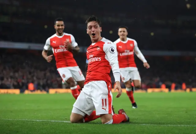 Mesut Ozil celebrates scoring a goal for Arsenal