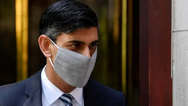 Britain"s Chancellor of the Exchequer, Rishi Sunak, leaves a television studio in London