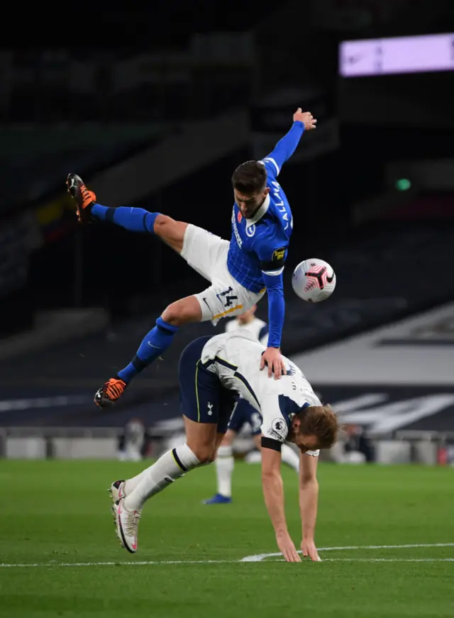 Lallana fouls Kane in the penalty area