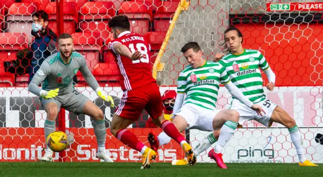 Aberdeen's Conor McLennan is pulled down by Celtic's Callum McGregor