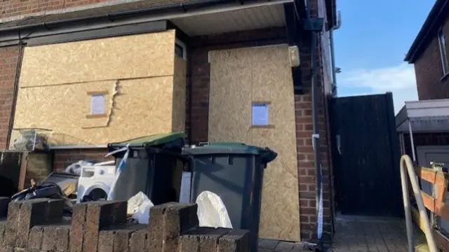 Boarded up house