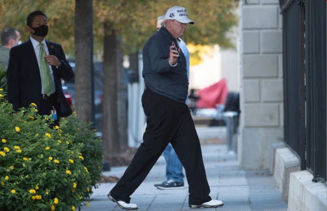 Trump arrives back at the White House after playing golf