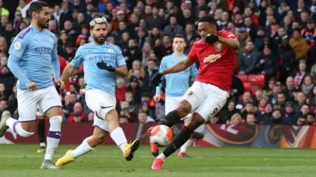 Anthony Martial scores against Manchester City