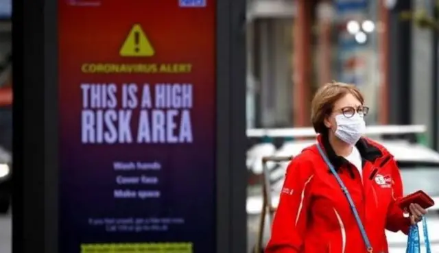 Coronavirus sign and woman wearing mask