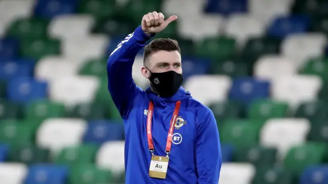 Stuart Dallas gives the fans the thumbs up at Windsor Park