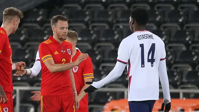 Players shake hands at full time