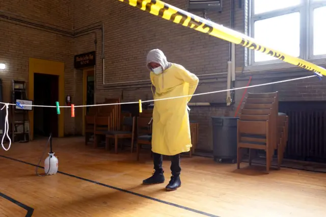 A workers gets prepared to help residents perform tests at a test site in the Englewood neighbourhood on November 12, 2020 in Chicago