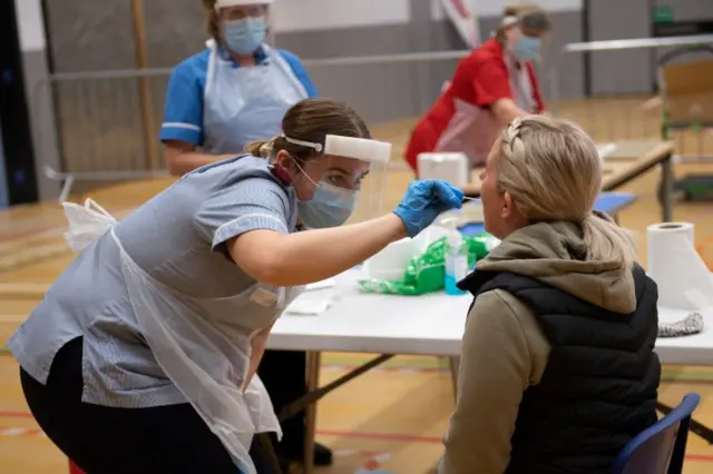 A woman being given a coronavirus test in Stoke-on-Trent