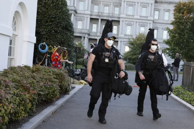 Secret Service men walking with their gear in Washington DC