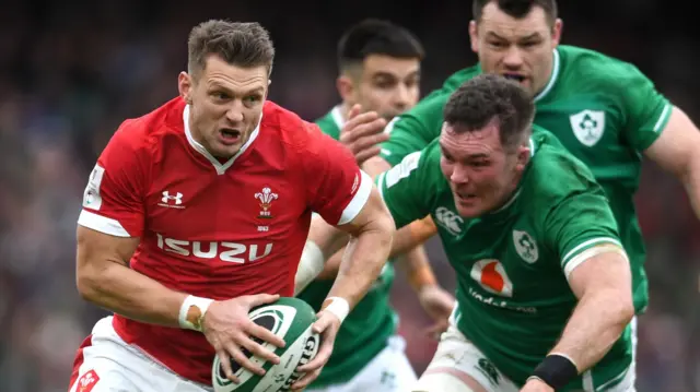 Wales' Dan Biggar (left) takes on Peter O'Mahony of Ireland