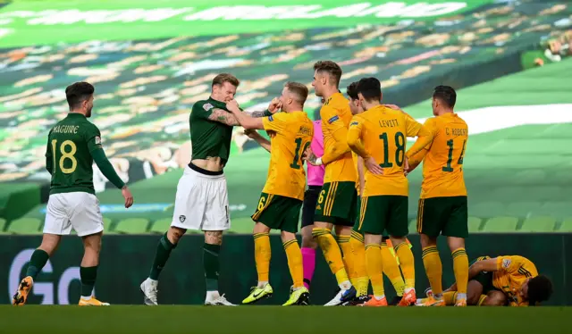 Republic of Ireland and Wales players square up to each other in last match