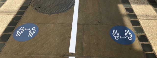 Distancing marks on pavement