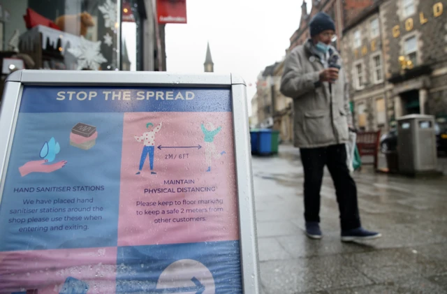 A sign advising customers about the spread of coronavirus outside a shop in Stirling.