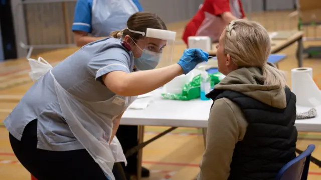 A lateral flow test being administered