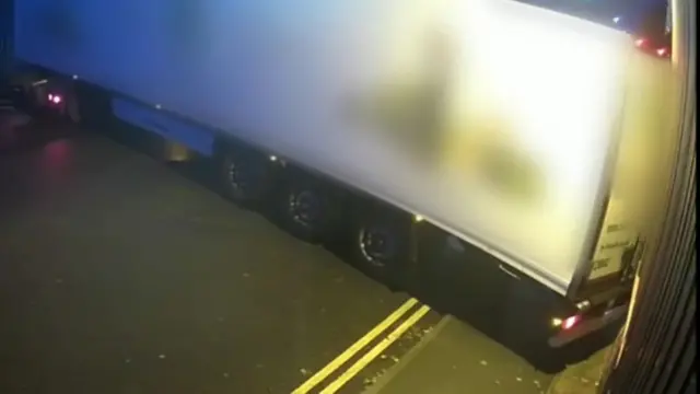 Lorry colliding with building