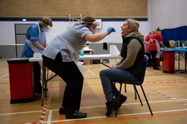 Nurse carrying out a test for the lateral flow test kits