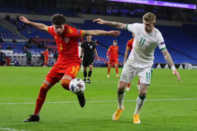 Republic of Ireland's James McClean (right) challenges Neco Williams of Wales