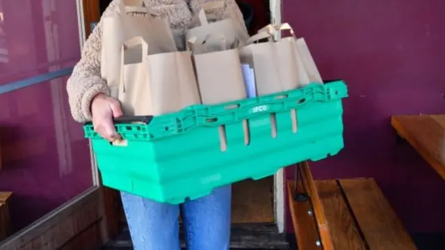 Packed lunches being handed out last half-term