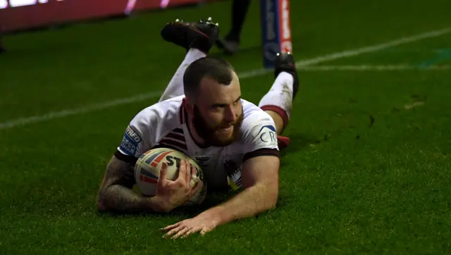 Jake Bibby grabs Wigan's fourth try against Hull