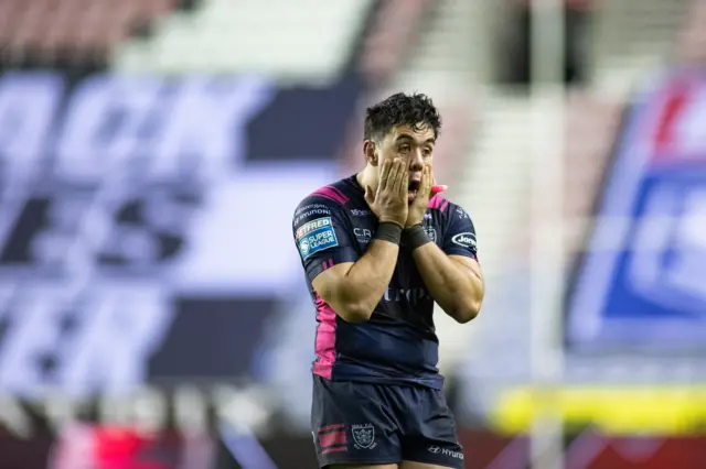 Andre Savelio of Hull FC is dejected after the game