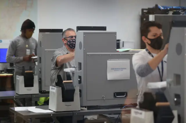 Florida election officials have begun processing over 8m votes