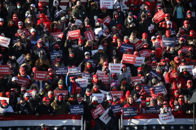 Supporters pray at a President Donald Trump rally on November 02, 2020 in Avoca, Pennsylvania. Donald Trump is crossing the crucial state of Pennsylvania in the last days of campaigning before Americans go to the polls on November 3rd to vote