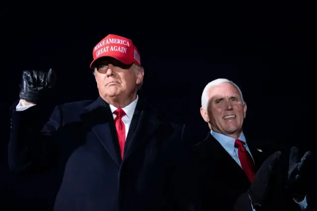 US President Donald Trump arrives with US Vice-President Mike Pence for a Make America Great Again rally at Cherry Capital Airport in Traverse City, Michigan on November 2, 2020