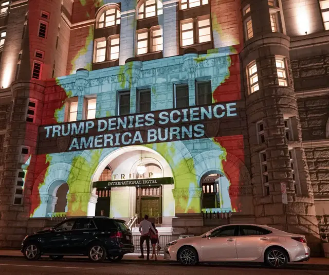 Protesters use projectors to cast images on Trump's Washington hotel