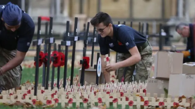 Work starts on laying crosses in the Field of Remembrance at Westminster Abbey in Westminster