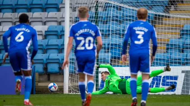 Jack Bonham saves a penalty